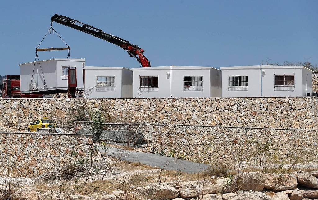 In an effort to take over occupied Palestinian land, Israeli settlers set up mobile homes near Salfit