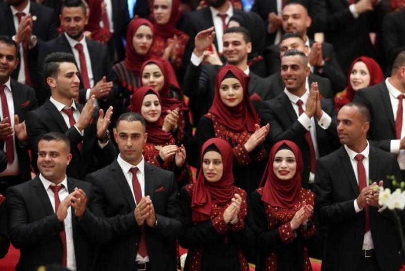 President Abbas sponsors mass wedding for 90 brides, grooms in Damascus