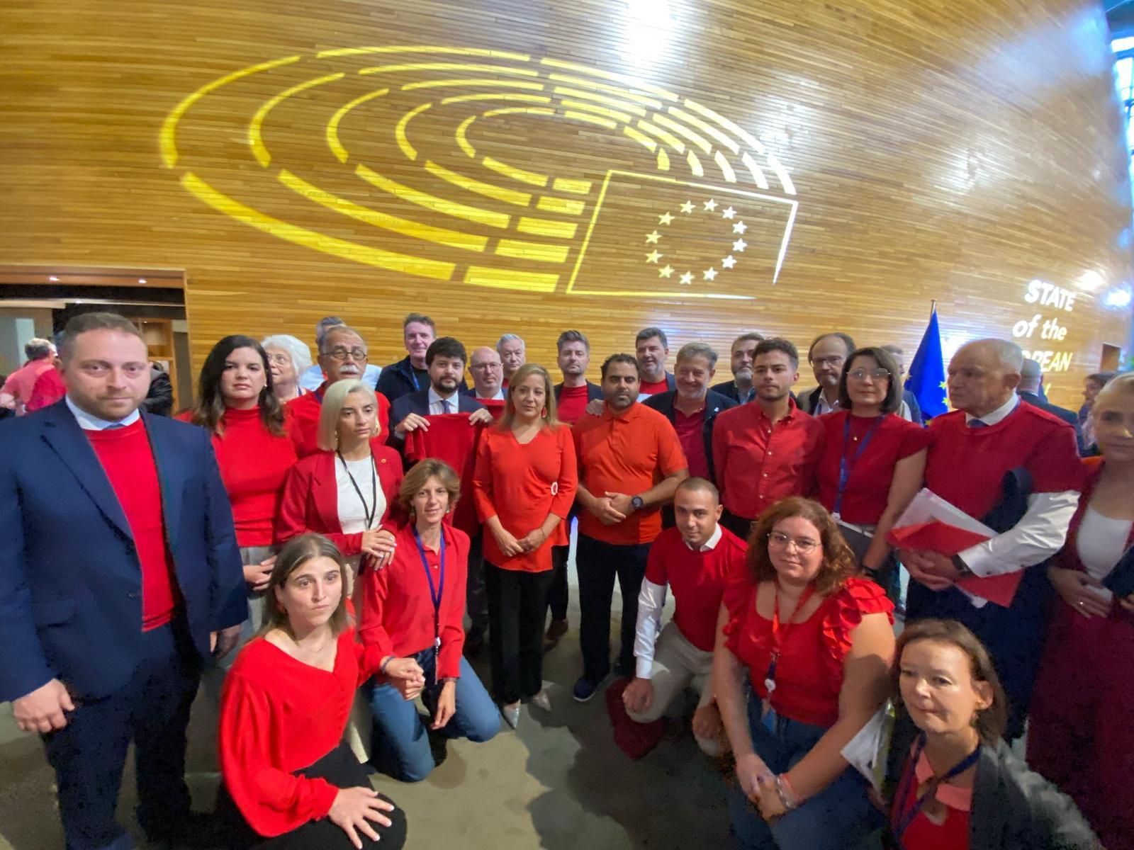 European parliament members wear red shirts in solidarity with Gaza
